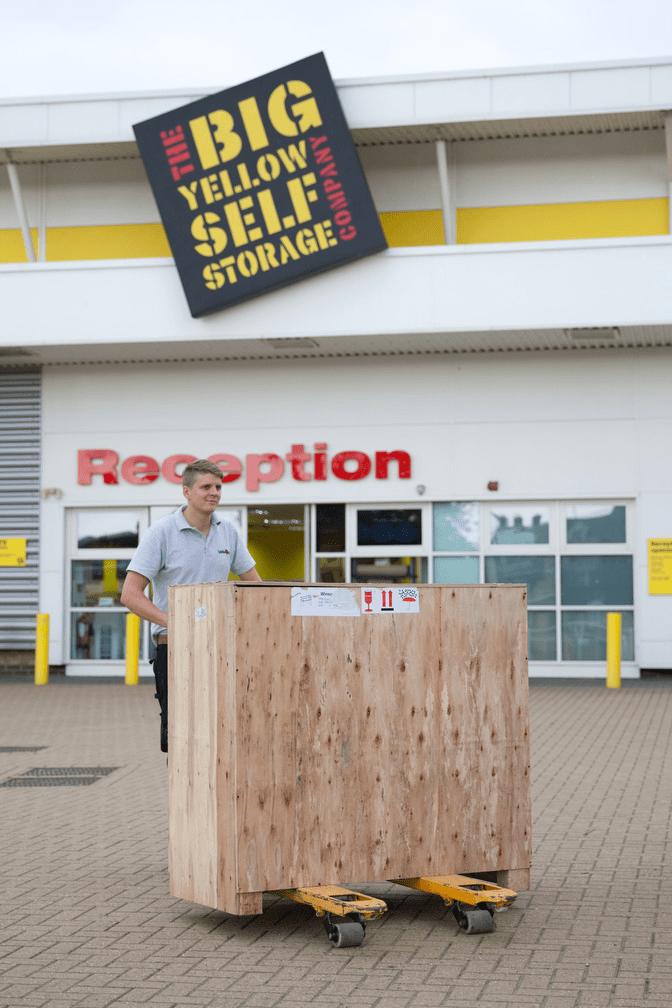 Loads4Less Employee Moving Pallet with Pallet Truck. Outside big yellow self storage Norwich.