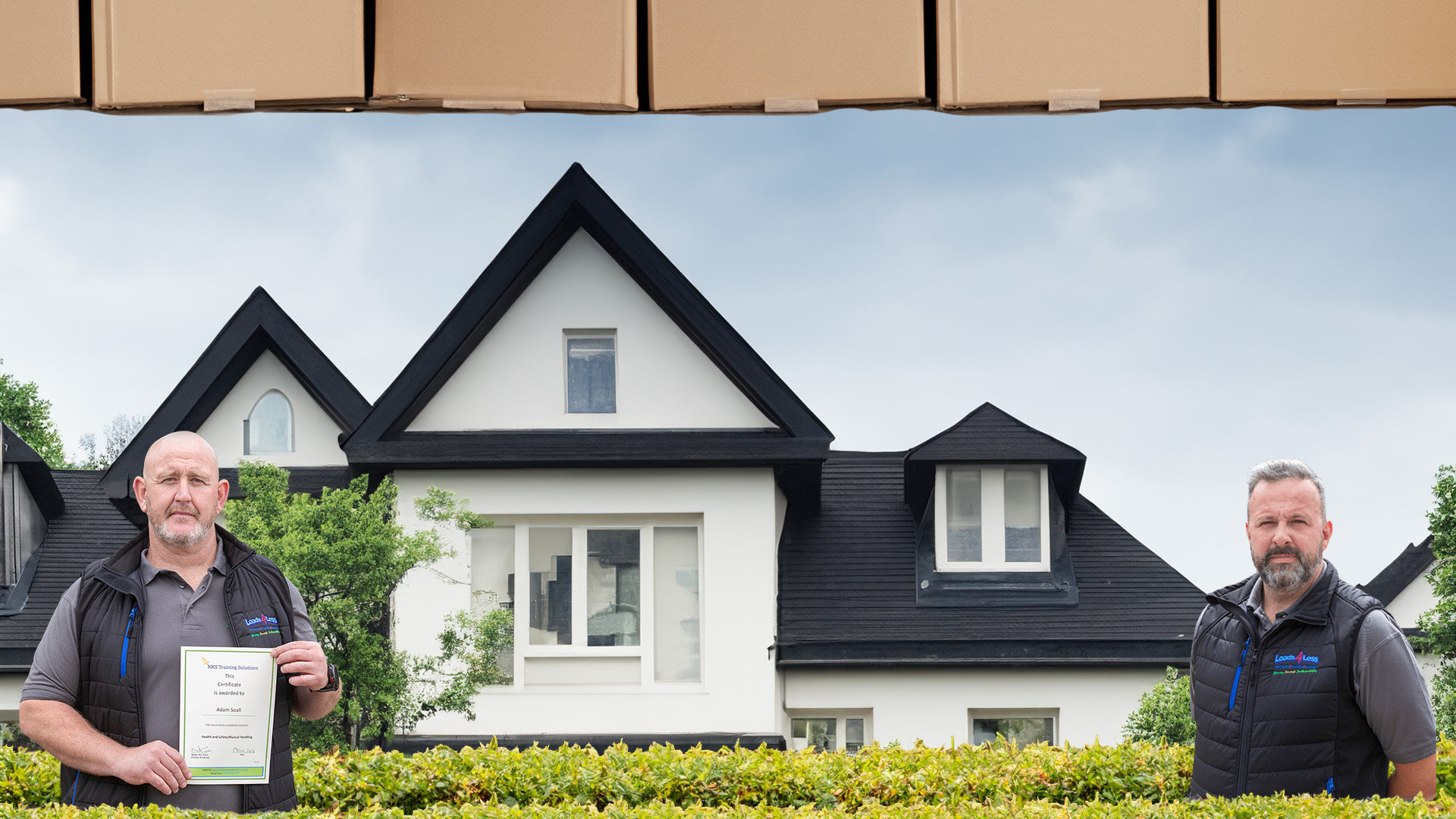 Adam Soall and commercial manager standing in front of a european black wood style house with bushes in front of them.